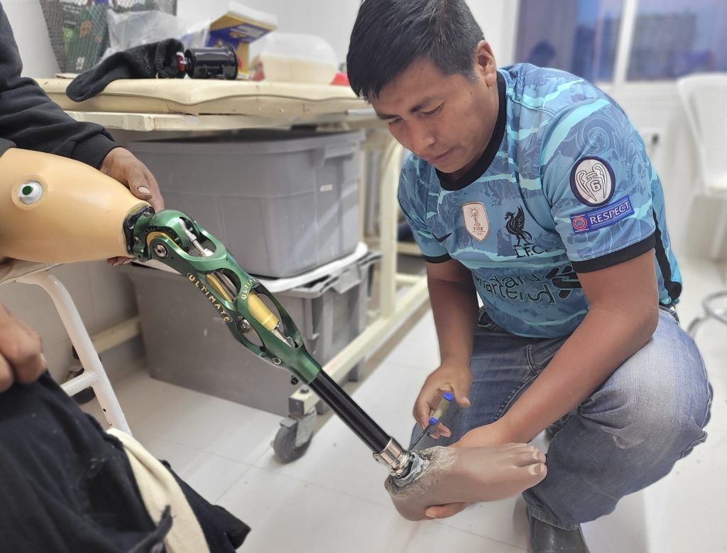 Elias working on prosthetic leg