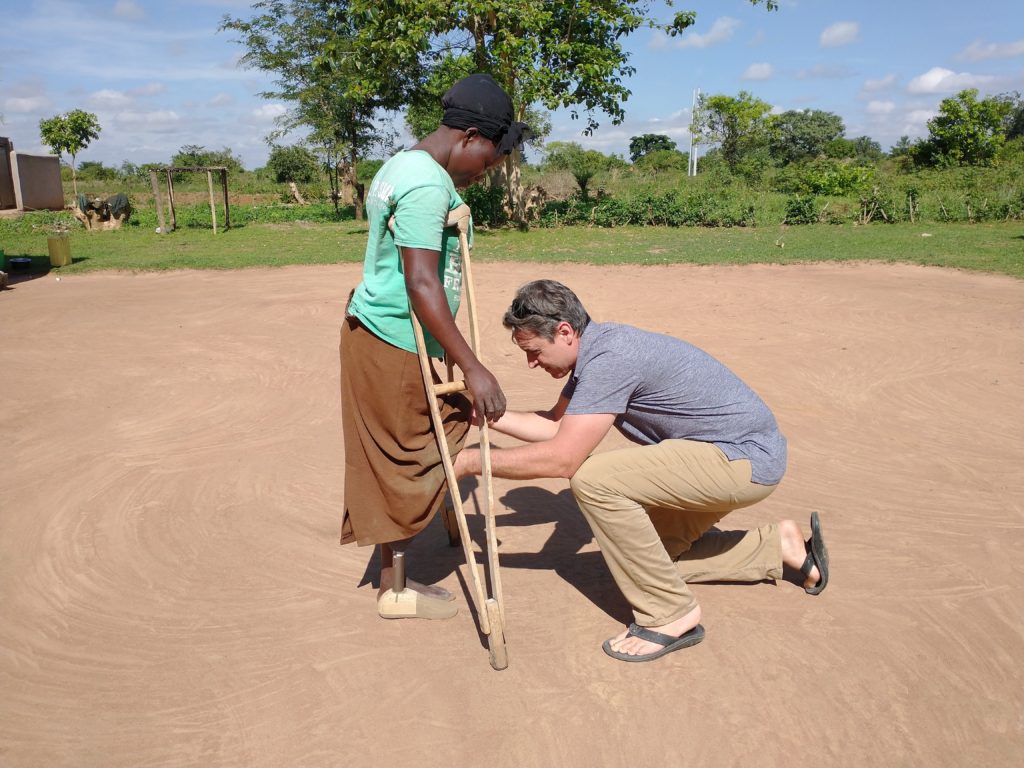 Steve adjusting new leg on woman